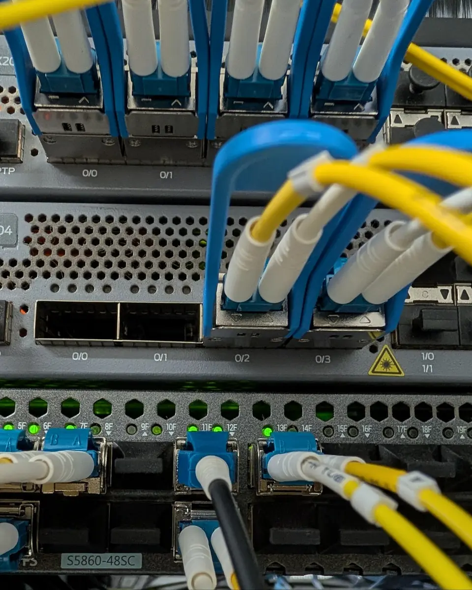 Core routers in Crowsnest's network with fiber jumpers connected to their ports.