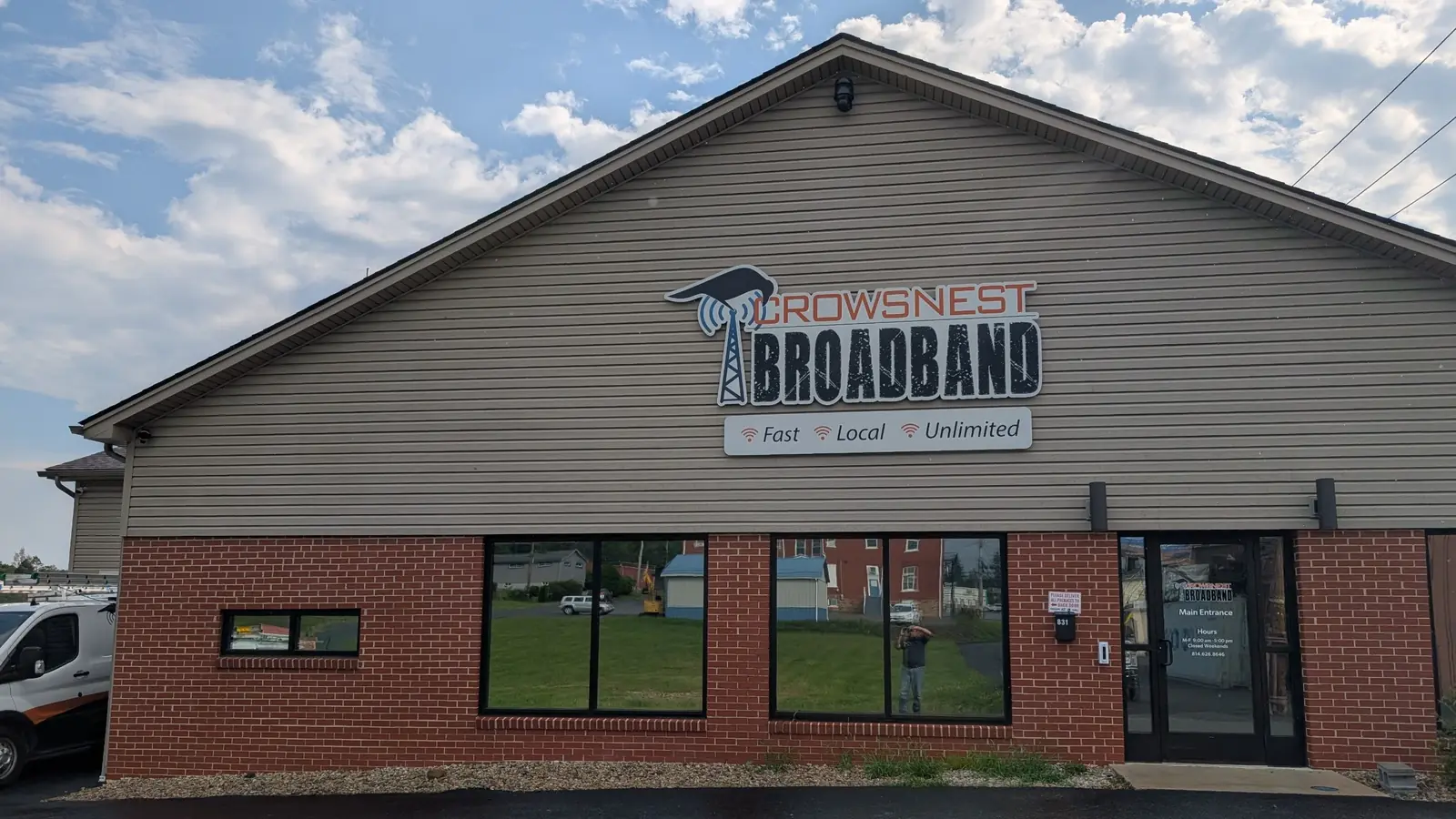 The front of the Crowsnest Broadband headquarters building, with the Crowsnest sign above the entrance.