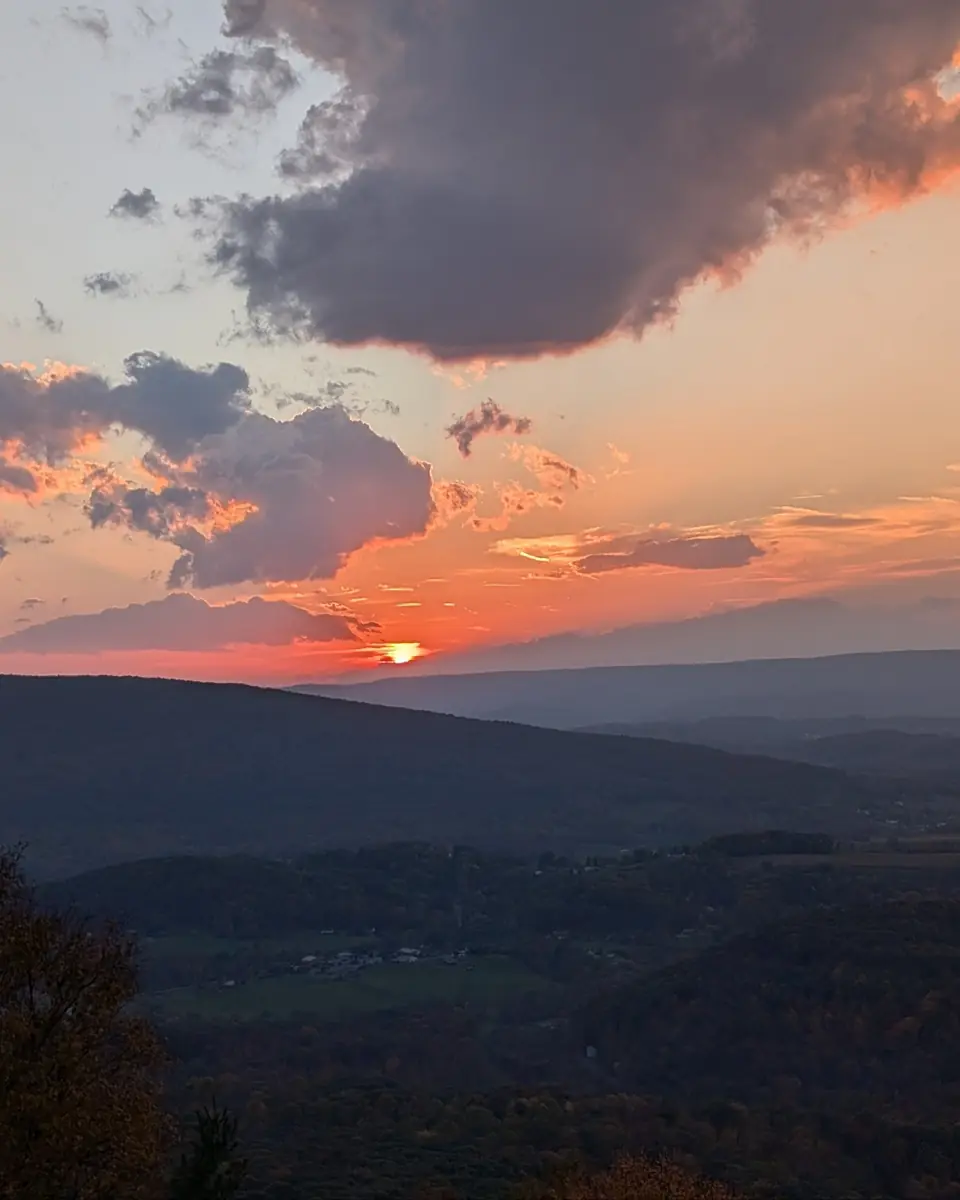 Sunset over layered Central Pennsylvania ridges and a valley in autumn.